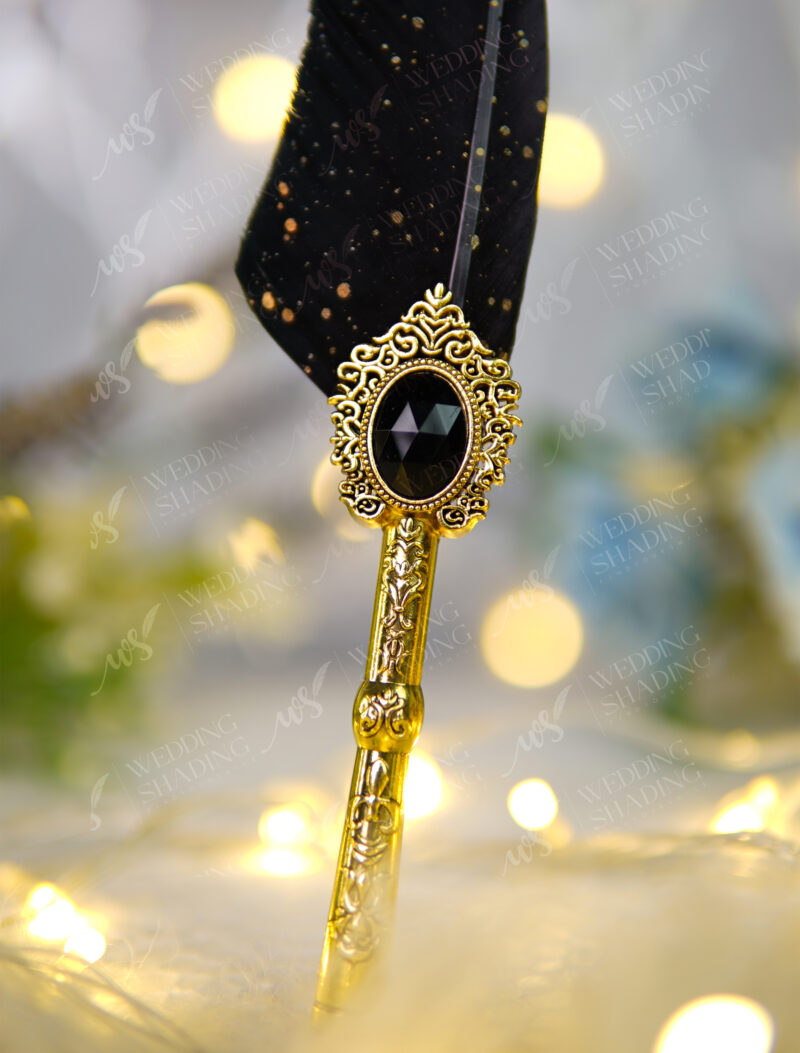 Beautifully ornate vintage golden centerpiece holding a deep jet black jewel