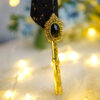 Phenomenally sleek jet black feather with brilliant cascading gold specks