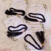 Black crystal tasbeeh attached to elegant Islamic favour cards