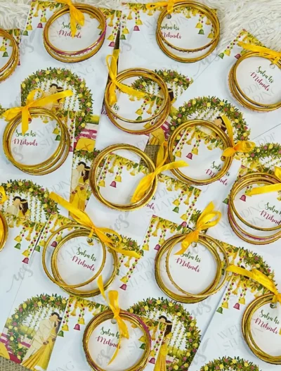 Bride and groom illustrated Mehndi favour cards with golden bangles