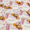 Chocolate candies attached to romantic engagement favour cards