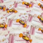 Chocolate candies attached to romantic engagement favour cards