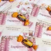 Close-up of Ideal chocolate on pink floral engagement card