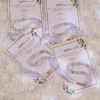 Clear crystal tasbeeh attached to white Islamic favour cards