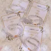 Elegant wedding favour cards with gold borders and clear tasbeeh