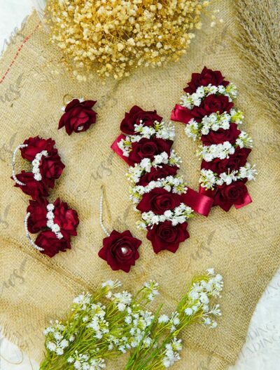 Complete bridal floral jewelry set in deep red including gajray, ring, earrings, and tikka