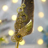 Close up of vintage gold steampunk gears and black crystal centerpiece