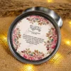 Close-up of "And we created you in pairs" design on tin box