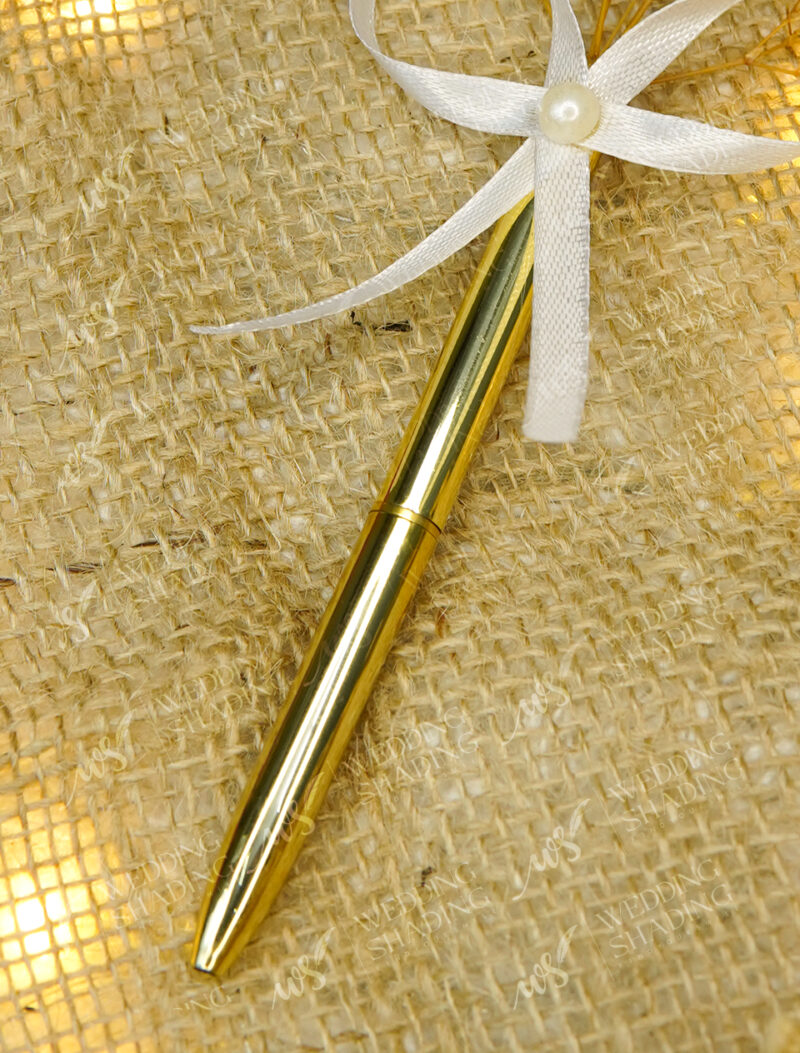 High shine deeply reflective golden metallic pen surface