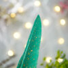 Incredible vibrant emerald green feather finished with beautiful gold specks