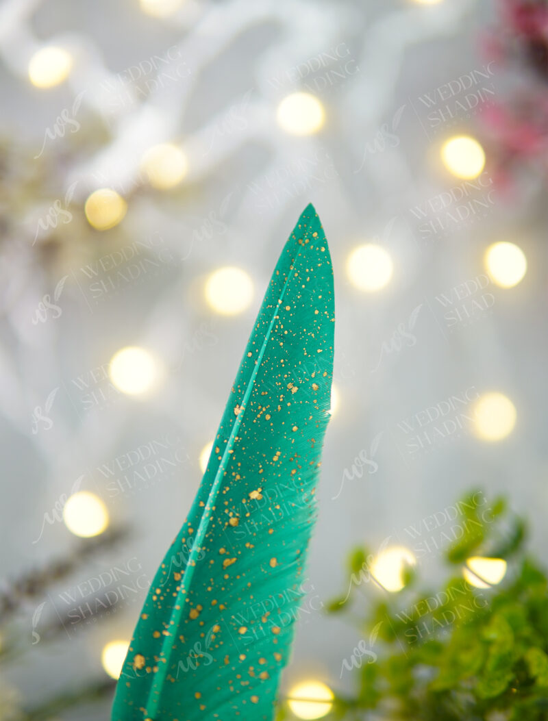 Incredible vibrant emerald green feather finished with beautiful gold specks