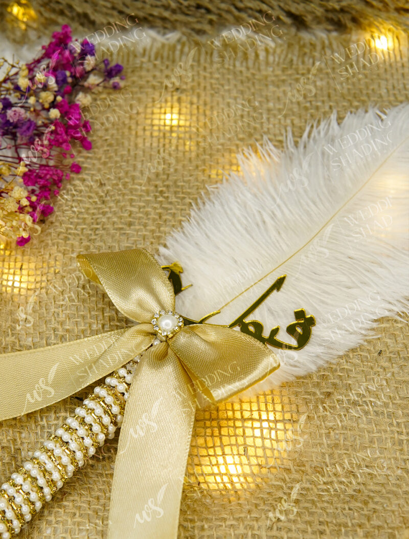 Exquisite handle encased in bright pearls and golden rhinestones
