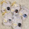 Close-up of shiny gold satin ribbon on Nikkah favour card