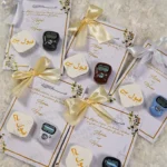 Multiple gold ribbon Islamic favour cards for Walima
