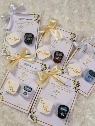 Multiple gold ribbon Islamic favour cards for Walima