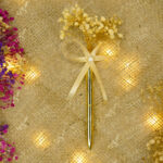 Golden Pen with Dried Floral Bouquet by Wedding Shading