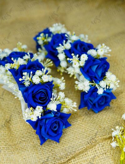 Multiple handcrafted blue rose floral gajray with white accents on white satin ribbon