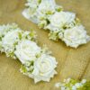 White rose gajray styled on a rustic burlap background