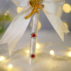 Stunning golden acrylic heart stating Qubool Hai above a white bow