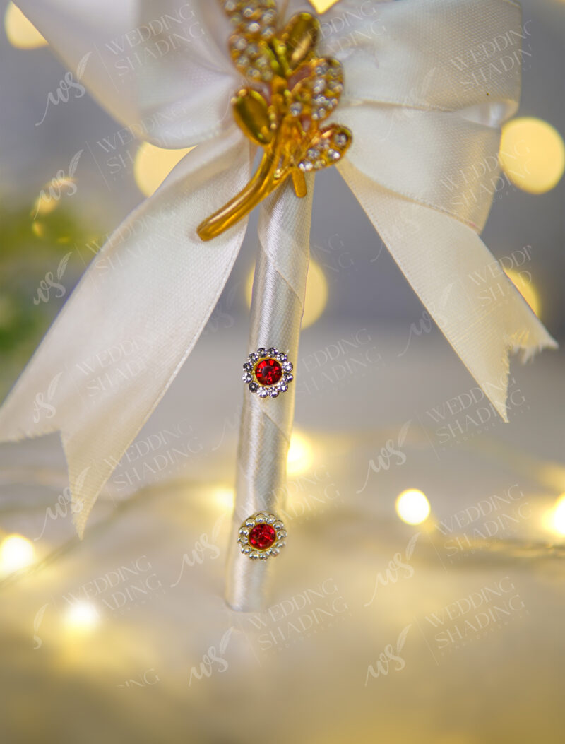 Stunning golden acrylic heart stating Qubool Hai above a white bow