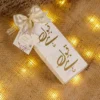 Close-up of gold Qubool Hai Arabic calligraphy on Bid Boxes