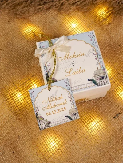 Close-up of custom Nikkah Mubarak tag with gold string