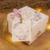 Multiple elegant white bid boxes for wedding favors