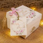 Multiple elegant white bid boxes for wedding favors