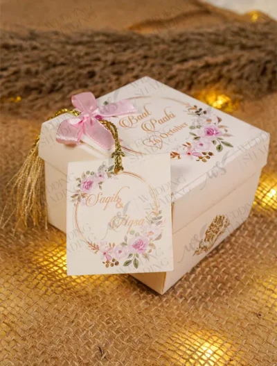 Multiple elegant white bid boxes for wedding favors