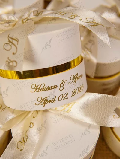 Close-up of gold printed names on elegant wedding ribbon