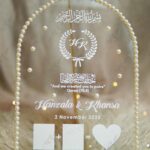 Clear dome acrylic thumb plate adorned with pearl border, Quranic verse, and white heart - front view