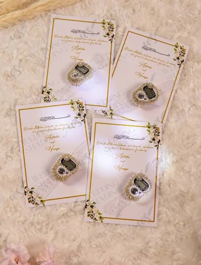 Premium white and gold favour cards featuring pearl tally rings