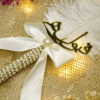 Beautiful white satin ribbon bow featuring a pearl and rhinestone center