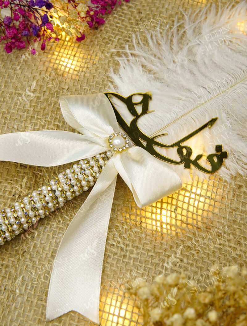 Beautiful white satin ribbon bow featuring a pearl and rhinestone center