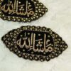 Close-up of intricate gold embroidery and sparkling stonework border on black velvet Imam Zamin