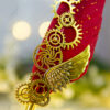 Polished metallic gold handle and gold speckles on red feather