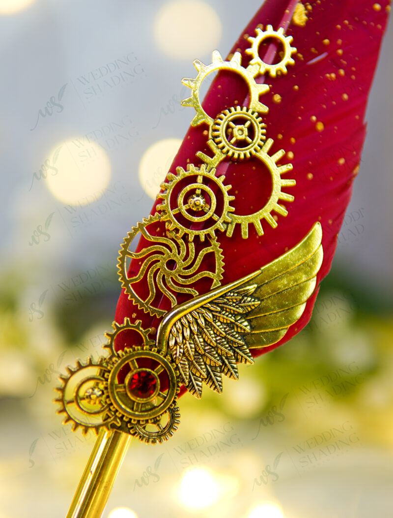 Polished metallic gold handle and gold speckles on red feather