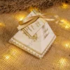 Multiple gold pyramid wedding bid boxes arranged for guests