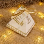 Multiple gold pyramid wedding bid boxes arranged for guests