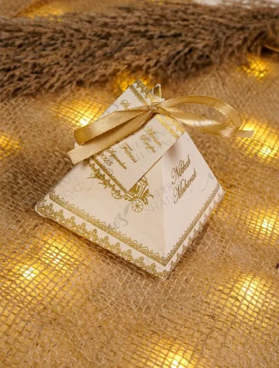 Multiple gold pyramid wedding bid boxes arranged for guests