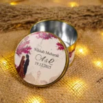 Gold-rimmed tin Bid Boxes with illustrated couple design
