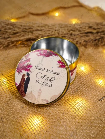 Gold-rimmed tin Bid Boxes with illustrated couple design