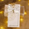 Close-up of customized engagement tag with dried flower