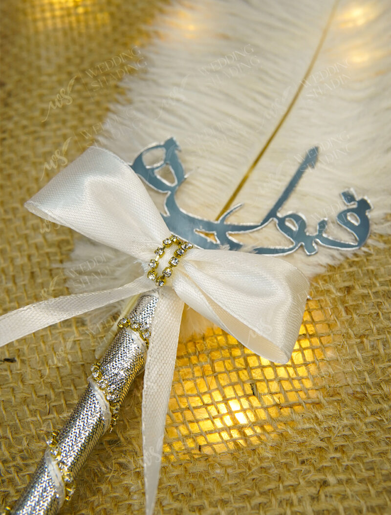 Shining silver acrylic Qubool Hai calligraphy and rhinestone bow detail