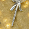 Highlight of the silver Qubool Hai typography and metallic ribbon bow