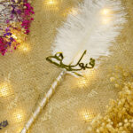 The shimmering silver metallic handle decorated with spiraling crystals