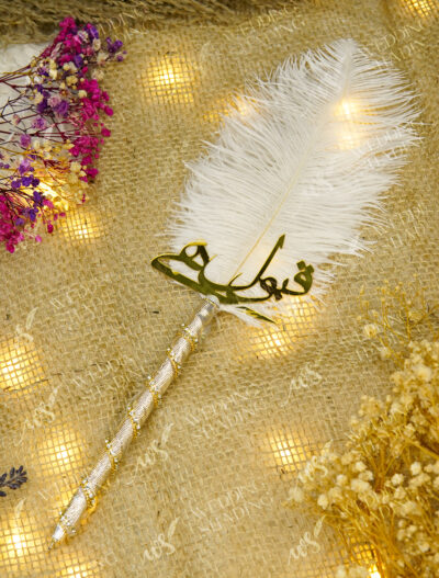 The shimmering silver metallic handle decorated with spiraling crystals