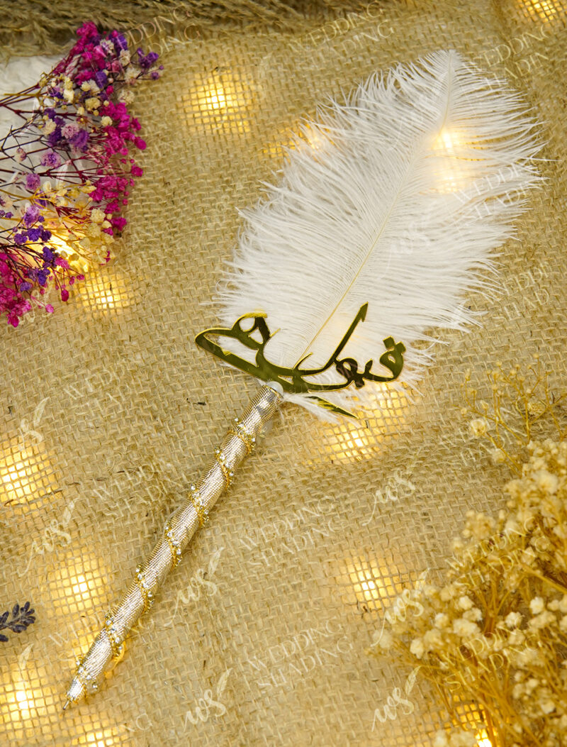 The shimmering silver metallic handle decorated with spiraling crystals