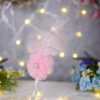 Side profile of the soft pink feather and crystal detailing for Nikkah signing