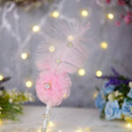 Side profile of the soft pink feather and crystal detailing for Nikkah signing